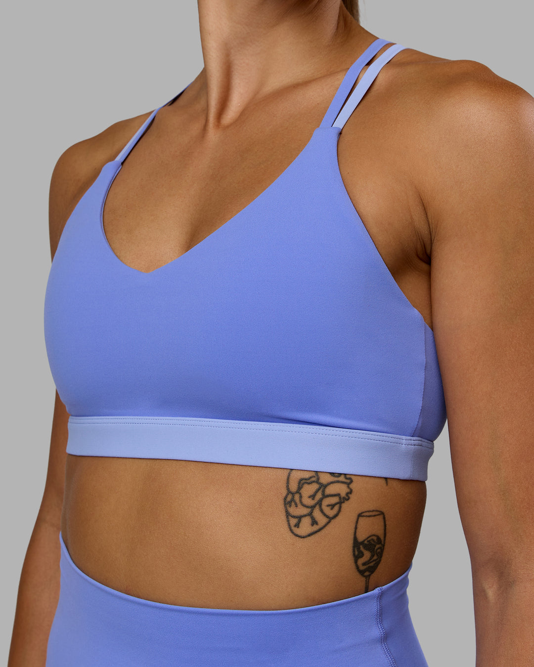 Woman wearing Nexus Sports Bra - Indulgent Blue