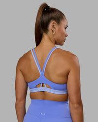 Woman wearing Nexus Sports Bra - Indulgent Blue