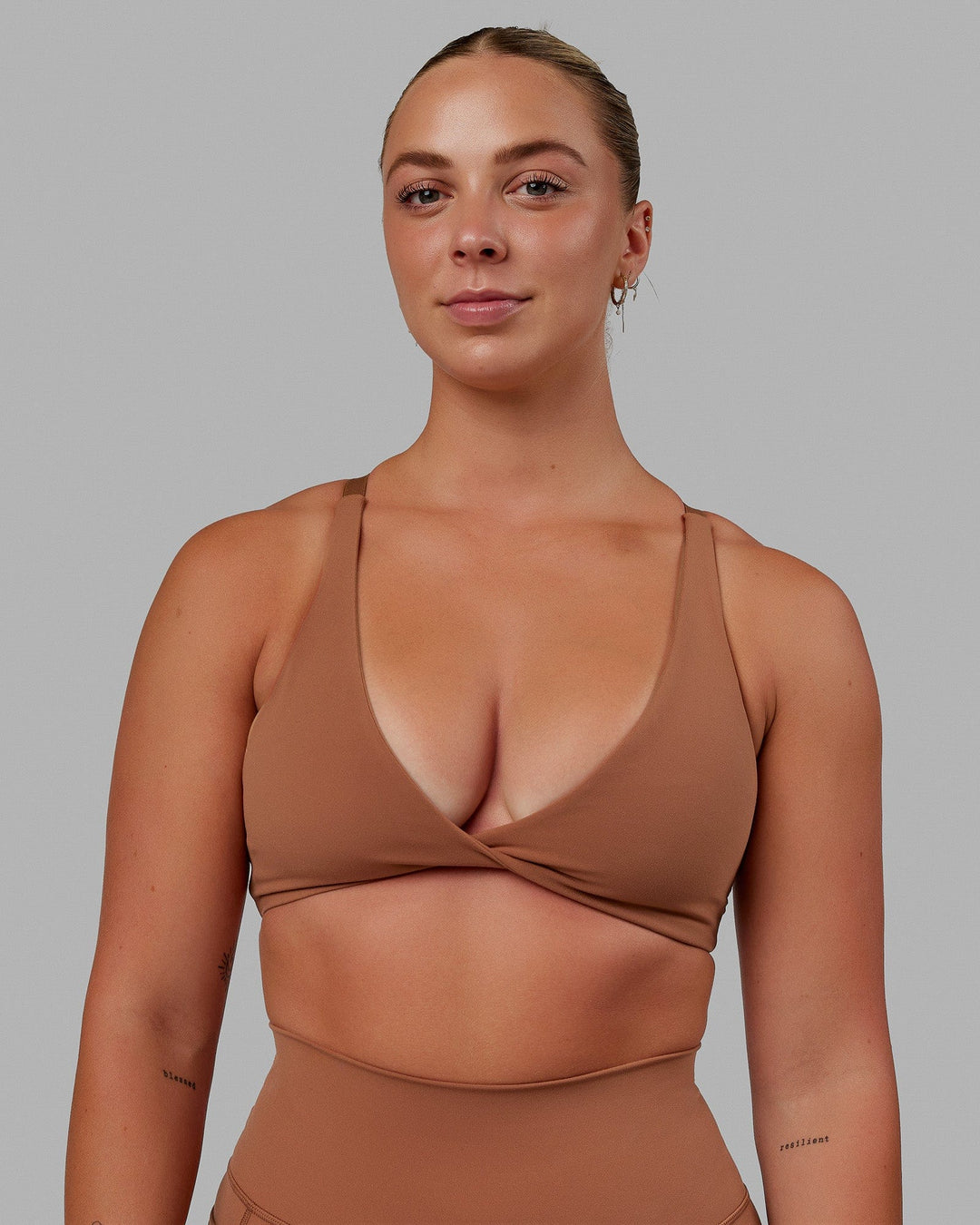 Woman wearing Nimble Sports Bra - Brick