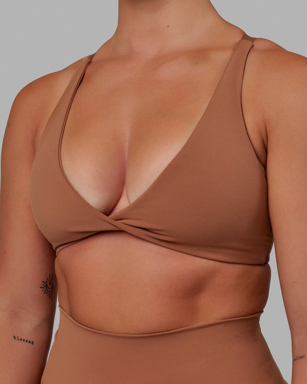 Woman wearing Nimble Sports Bra - Brick