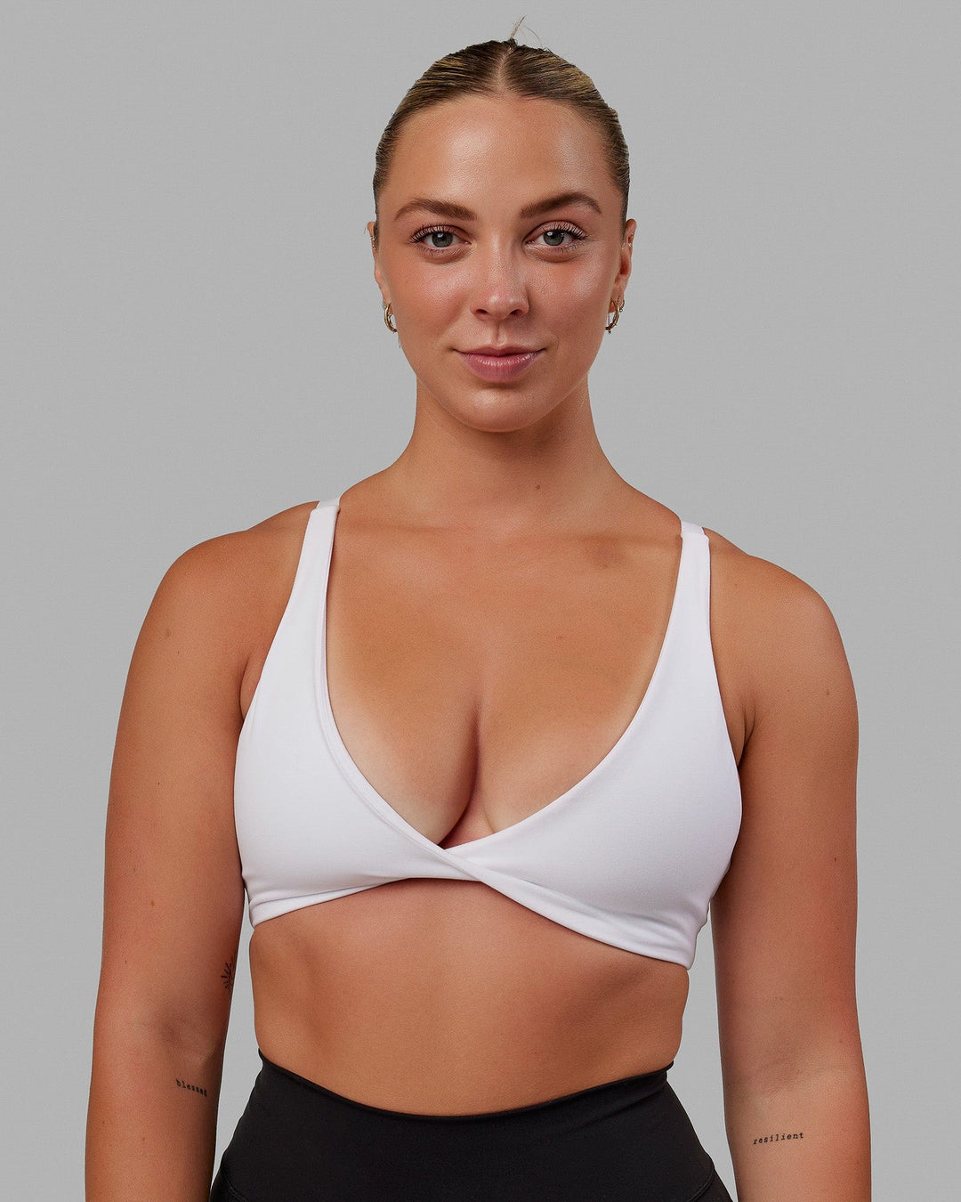Woman wearing Nimble Sports Bra - White