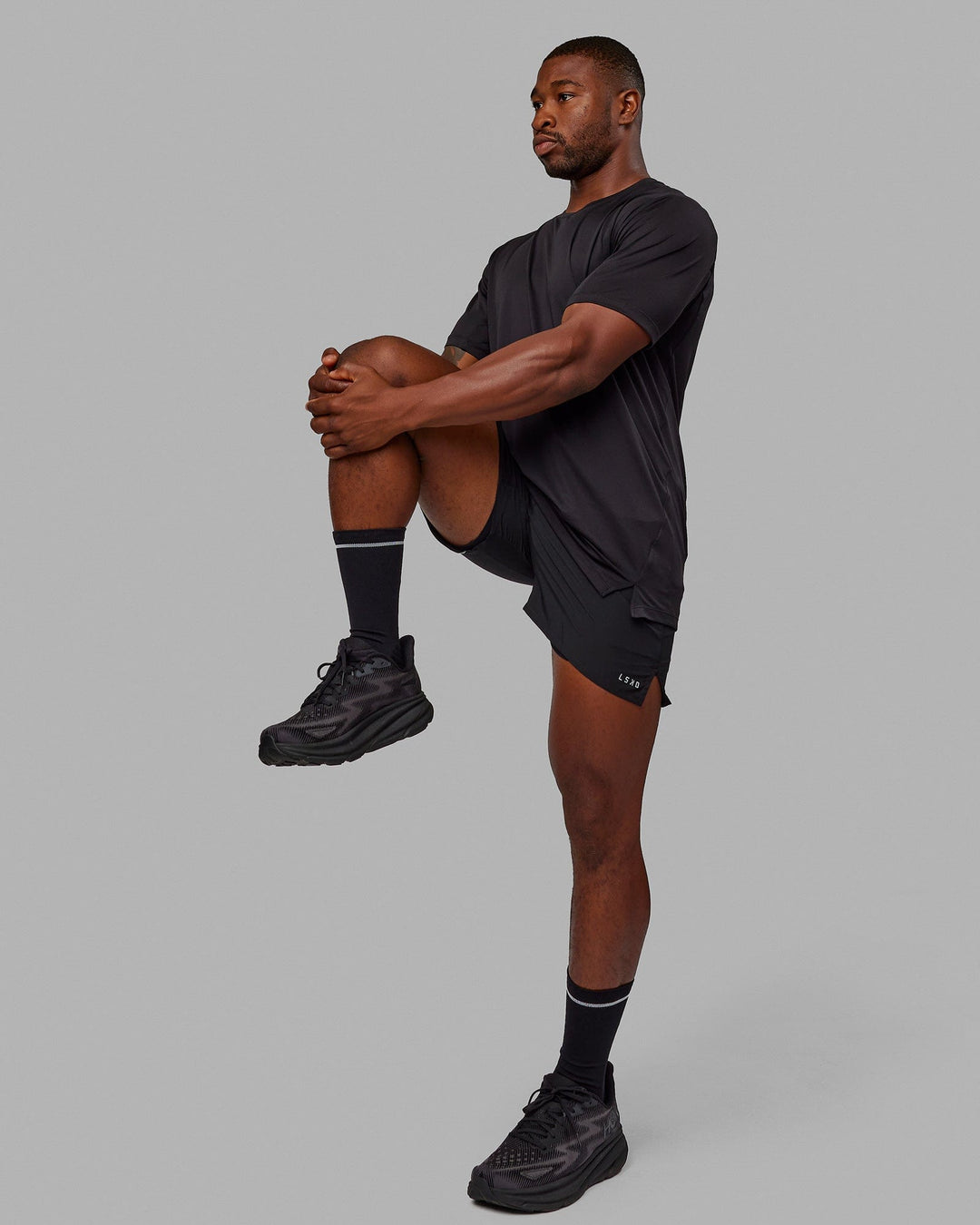 Man wearing Pace 5&quot; Lined Performance Shorts - Black-Reflective