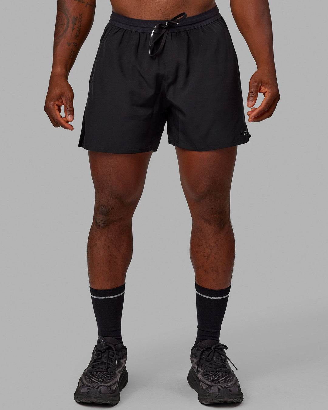 Man wearing Pace 5&quot; Lined Performance Shorts - Black-Reflective