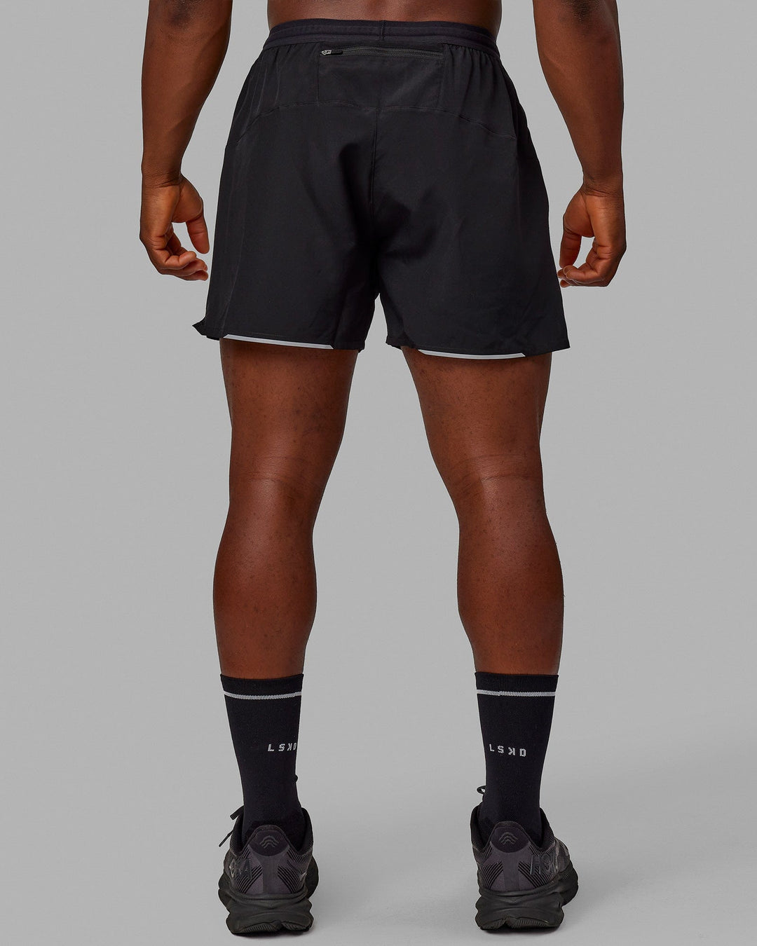 Man wearing Pace 5&quot; Lined Performance Shorts - Black-Reflective