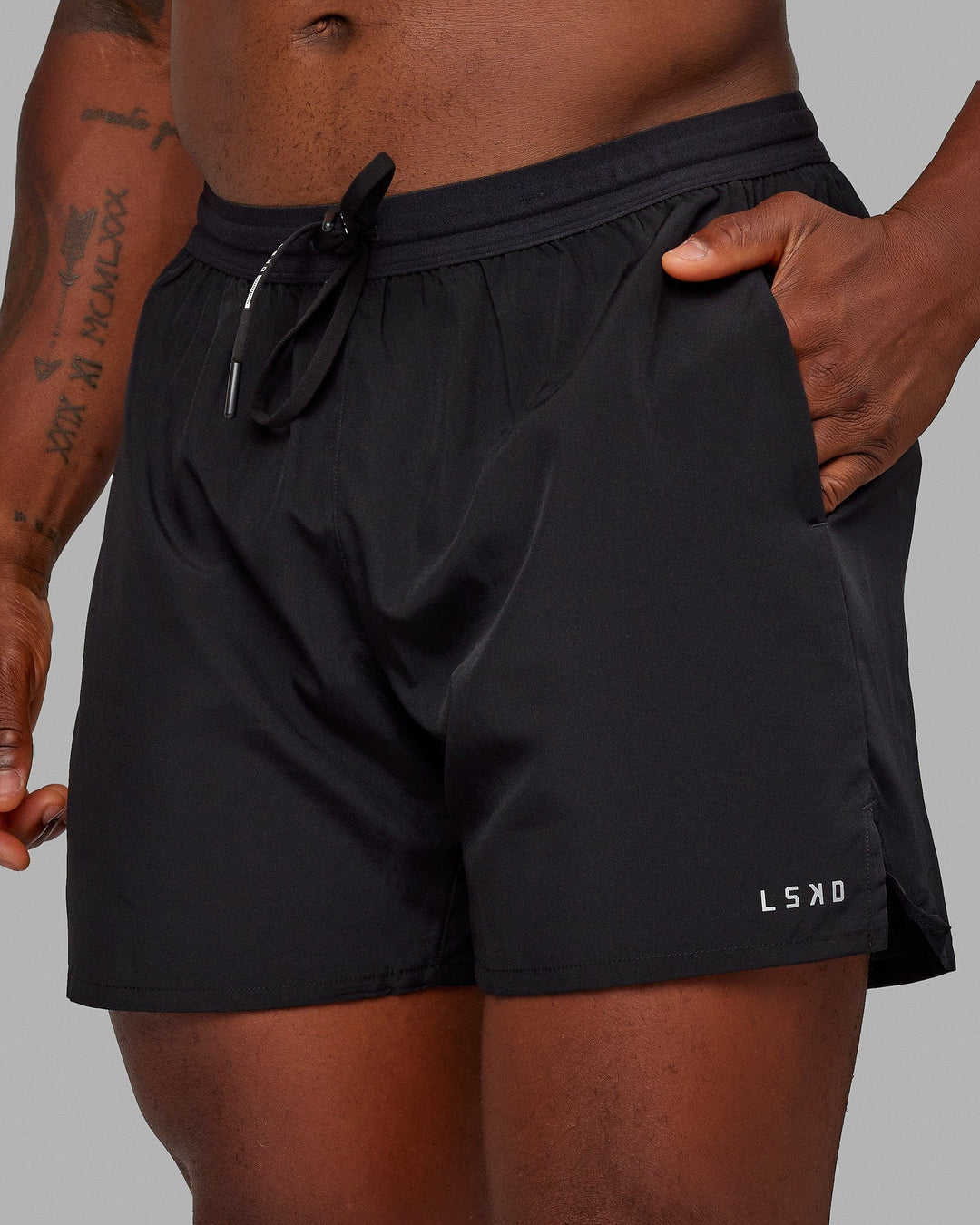 Man wearing Pace 5" Lined Performance Shorts - Black-Reflective