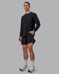 Man wearing Pace 5" Lined Performance Shorts - Black-Retro Blue