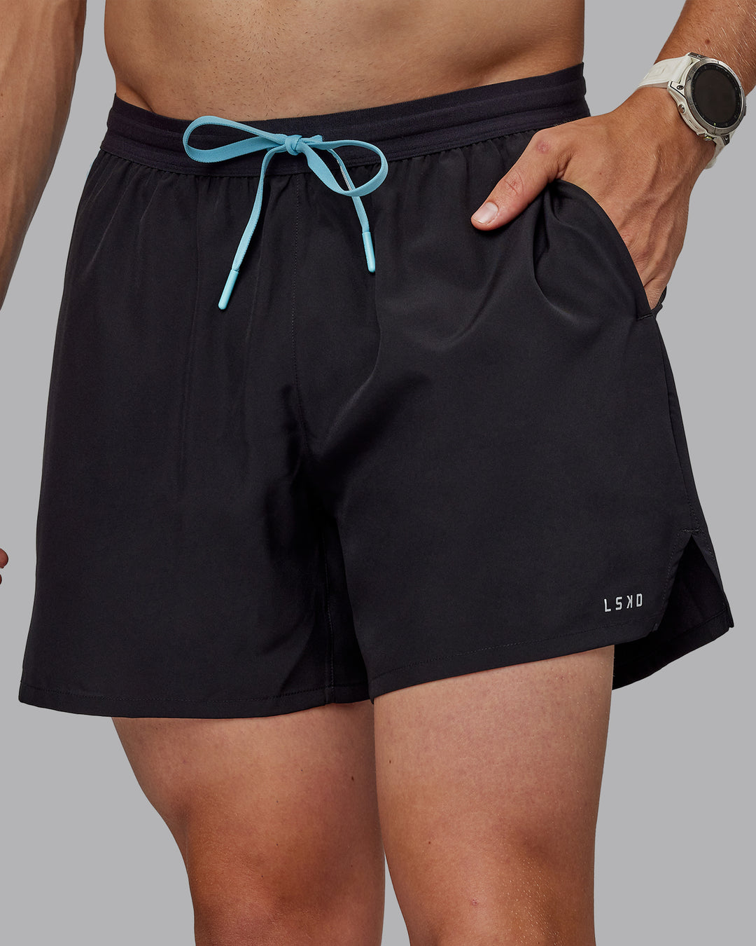 Man wearing Pace 5&quot; Lined Performance Shorts - Black-Retro Blue