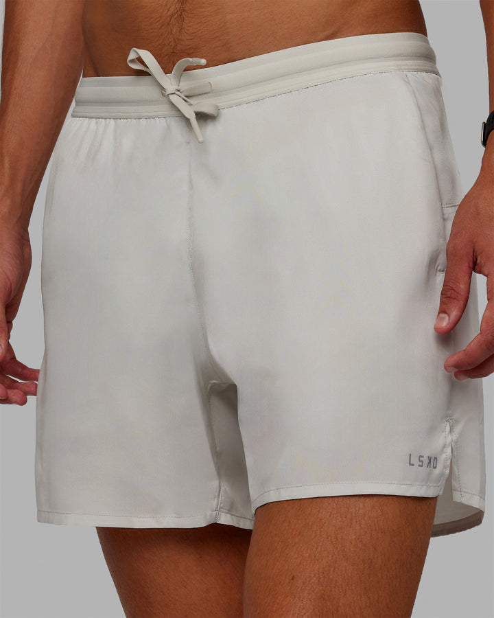 Man wearing Pace 5" Lined Performance Shorts - Digital Mist-Reflective