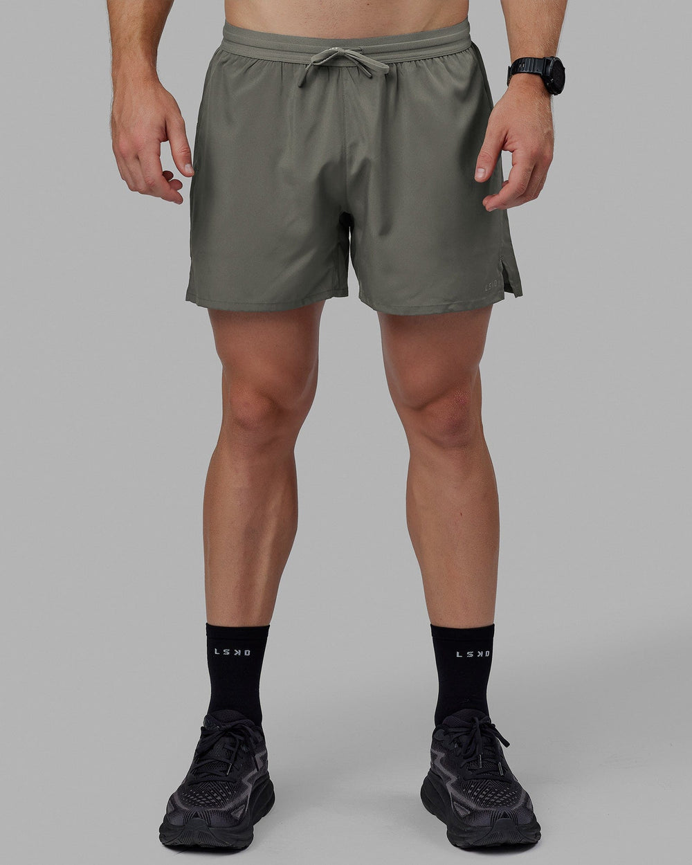 Man wearing Pace 5" Lined Performance Shorts - Graphite-Reflective