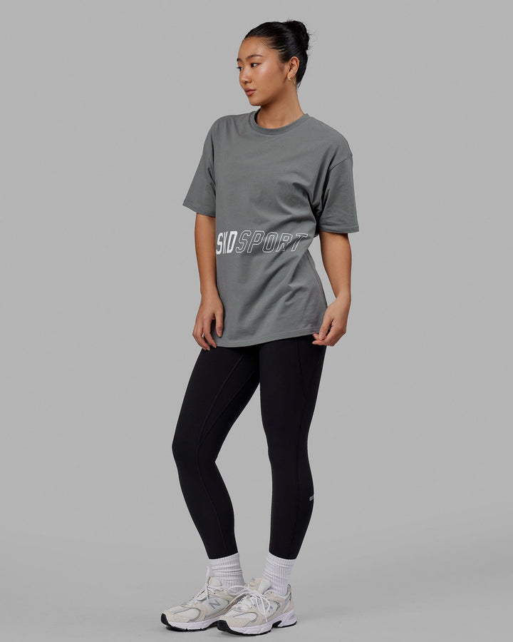 Woman wearing Unisex Pace FLXCotton Tee Oversize - Graphite