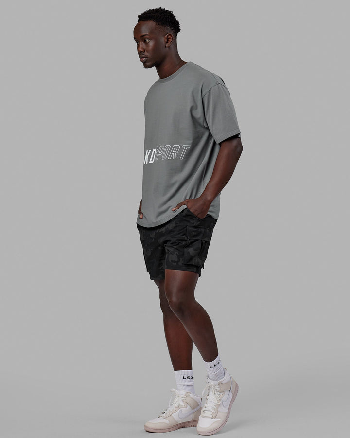 Man wearing Unisex Pace FLXCotton Tee Oversize - Graphite