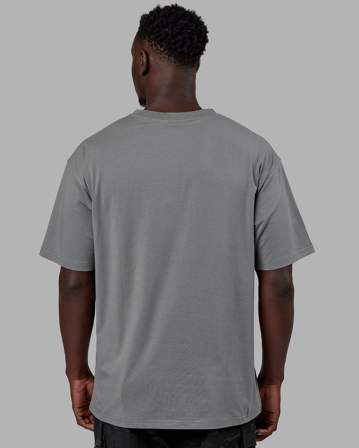 Man wearing Unisex Pace FLXCotton Tee Oversize - Graphite