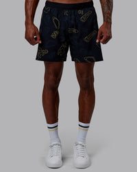 Man wearing Patty Mills Challenger 6" Performance Shorts - Black-Vital Green