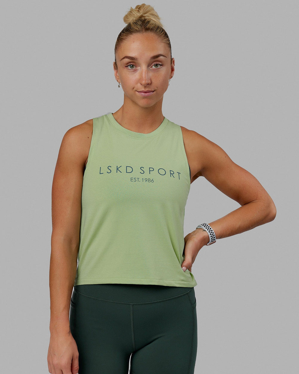Woman wearing Penalty Tank - Green Fig-Storm
