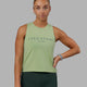 Woman wearing Penalty Tank - Green Fig-Storm