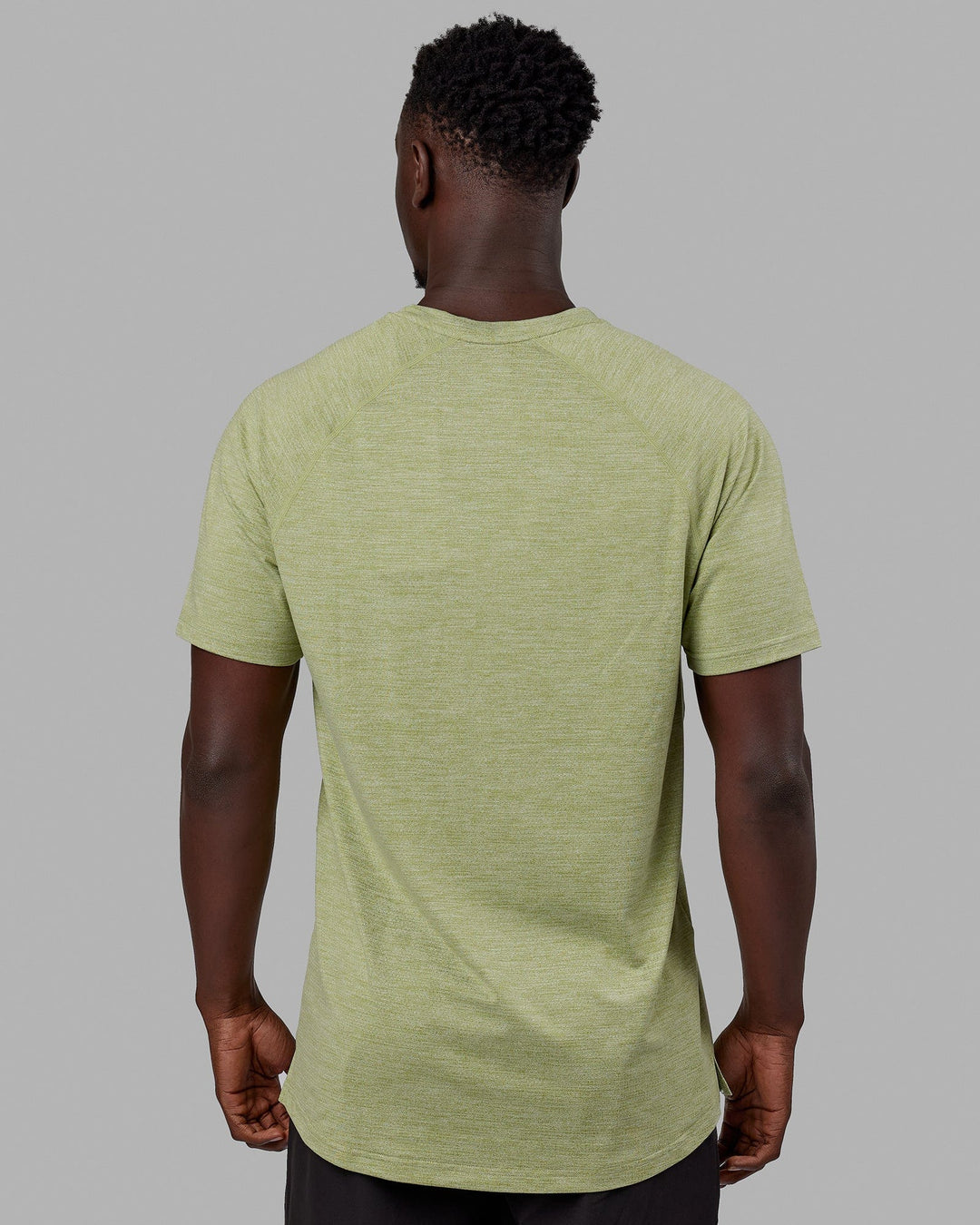 Man wearing Perform VapourFLX Tee - Moss Stone