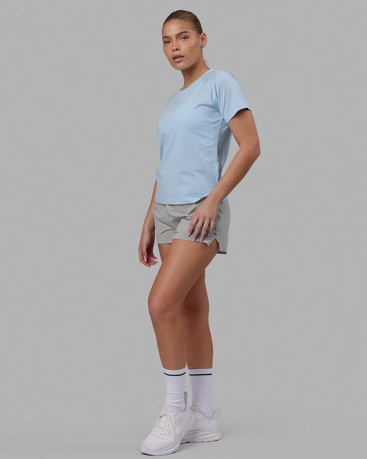 Woman wearing Perform VapourFLX Tee - Windsurfer Marl