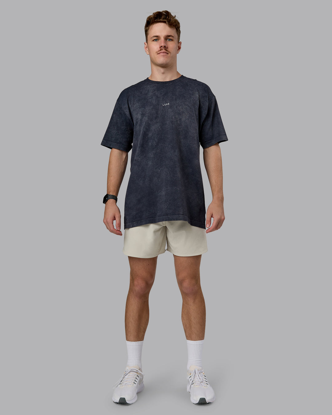 Man wearing Power Oversized Tee - Pirate Black Washed |Model:Cameron | Size:M