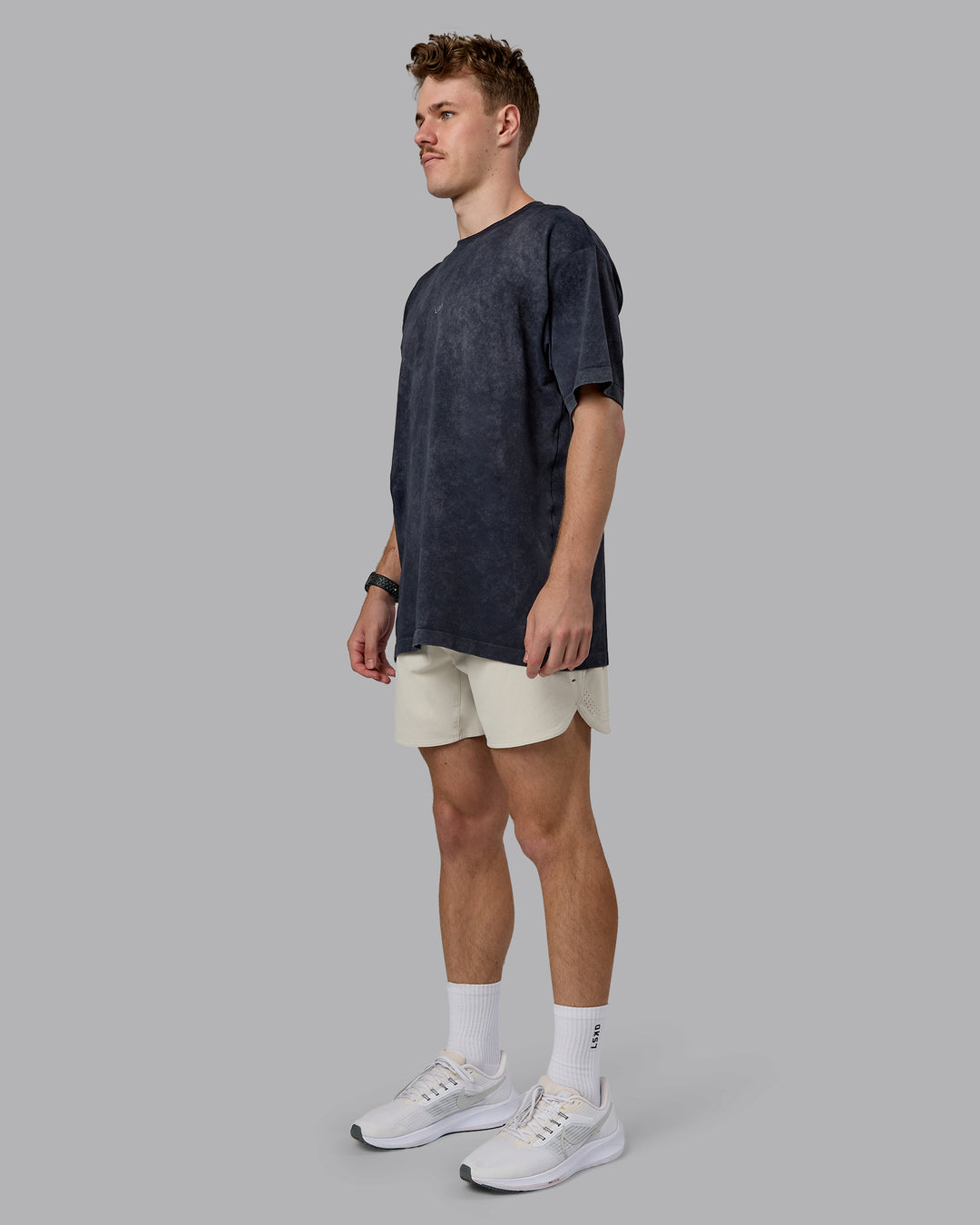 Man wearing Power Oversized Tee - Pirate Black Washed |Model:Cameron | Size:M