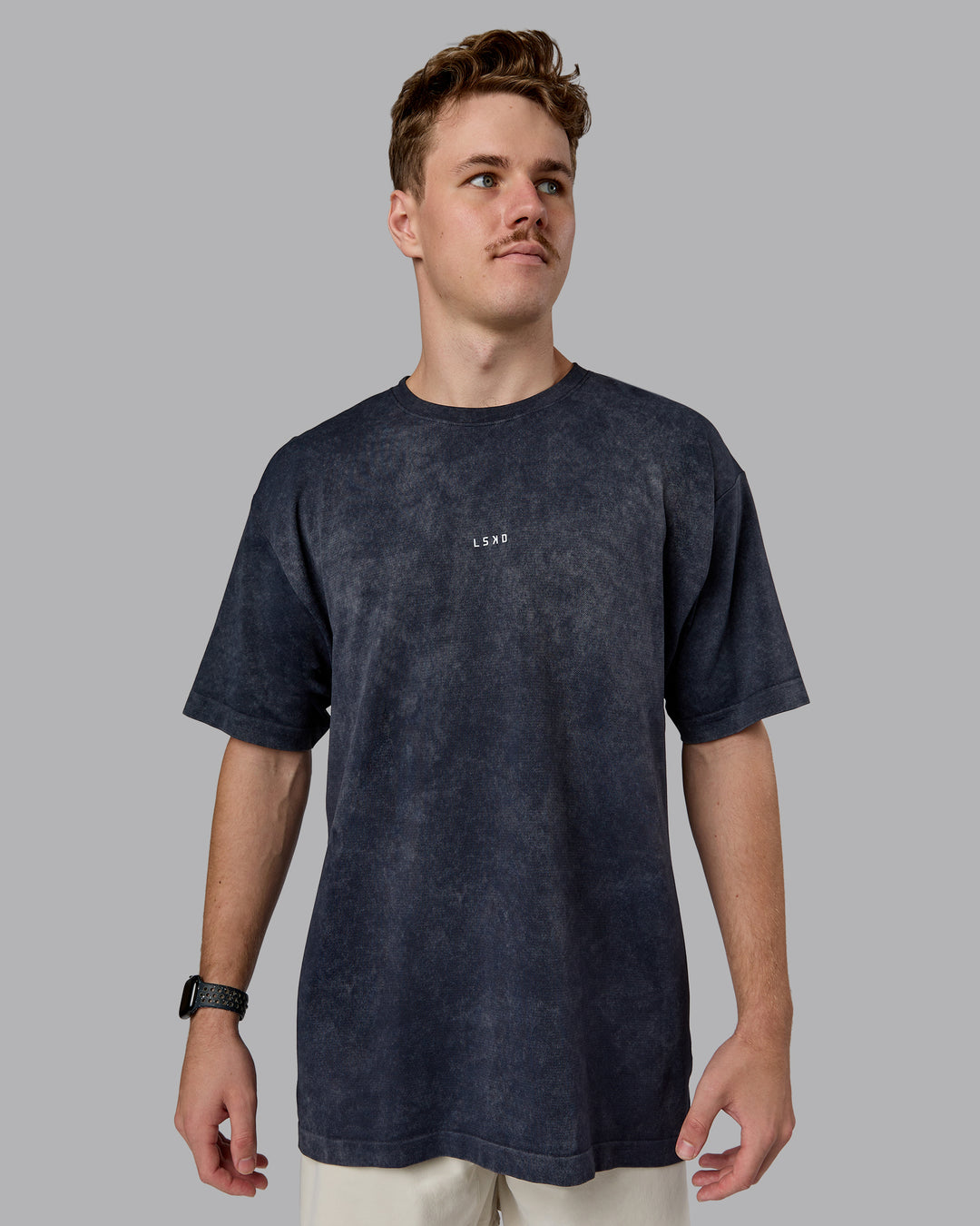 Man wearing Power Oversized Tee - Pirate Black Washed |Model:Cameron | Size:M