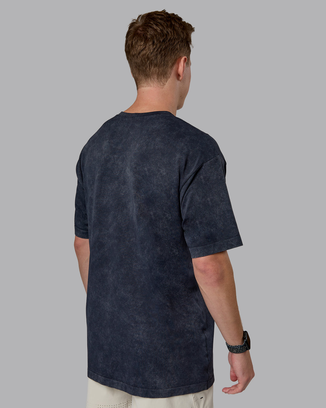 Man wearing Power Oversized Tee - Pirate Black Washed |Model:Cameron | Size:M
