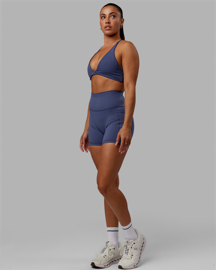 Woman wearing Progression Sports Bra - Future Dusk