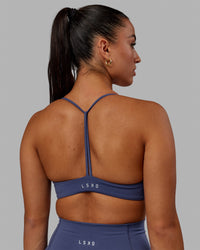 Woman wearing Progression Sports Bra - Future Dusk | Thumbnail Index: 2