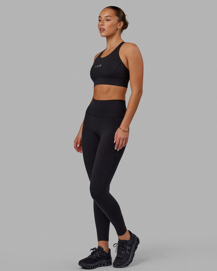 Woman wearing Propel Sports Bra - Black