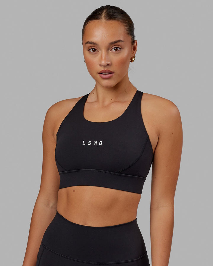 Woman wearing Propel Sports Bra - Black