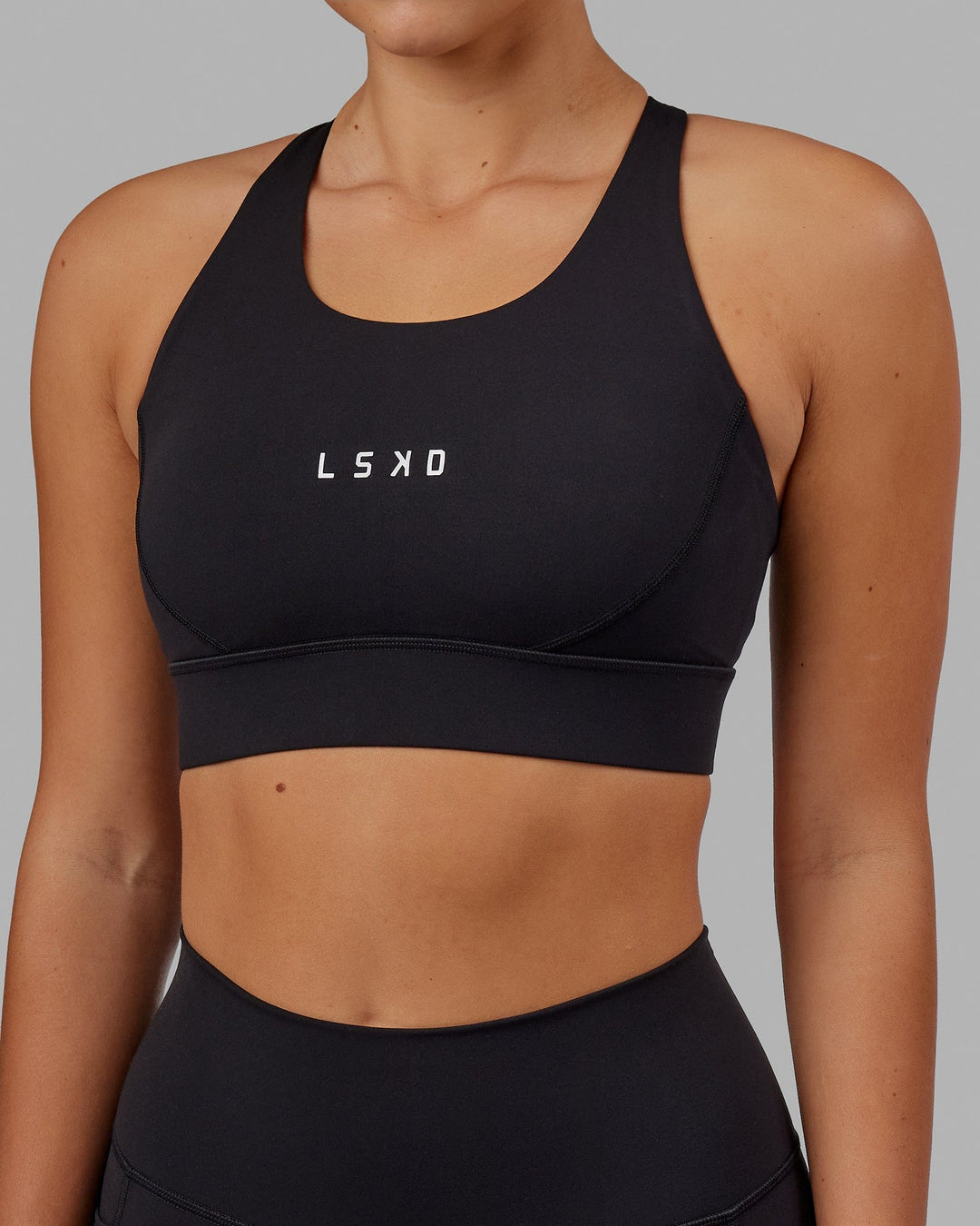 Woman wearing Propel Sports Bra - Black