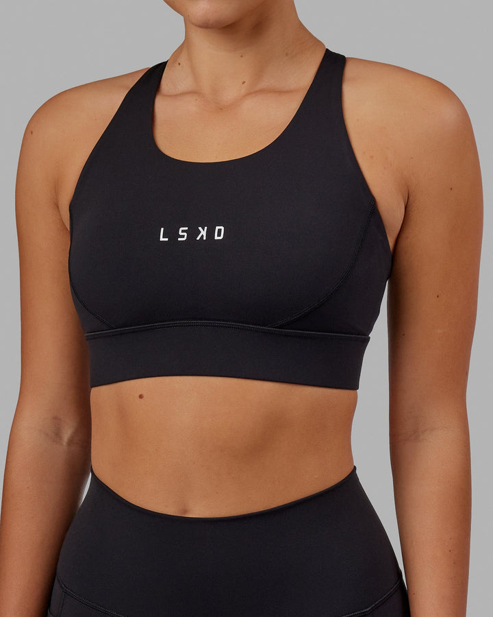 Woman wearing Propel Sports Bra - Black