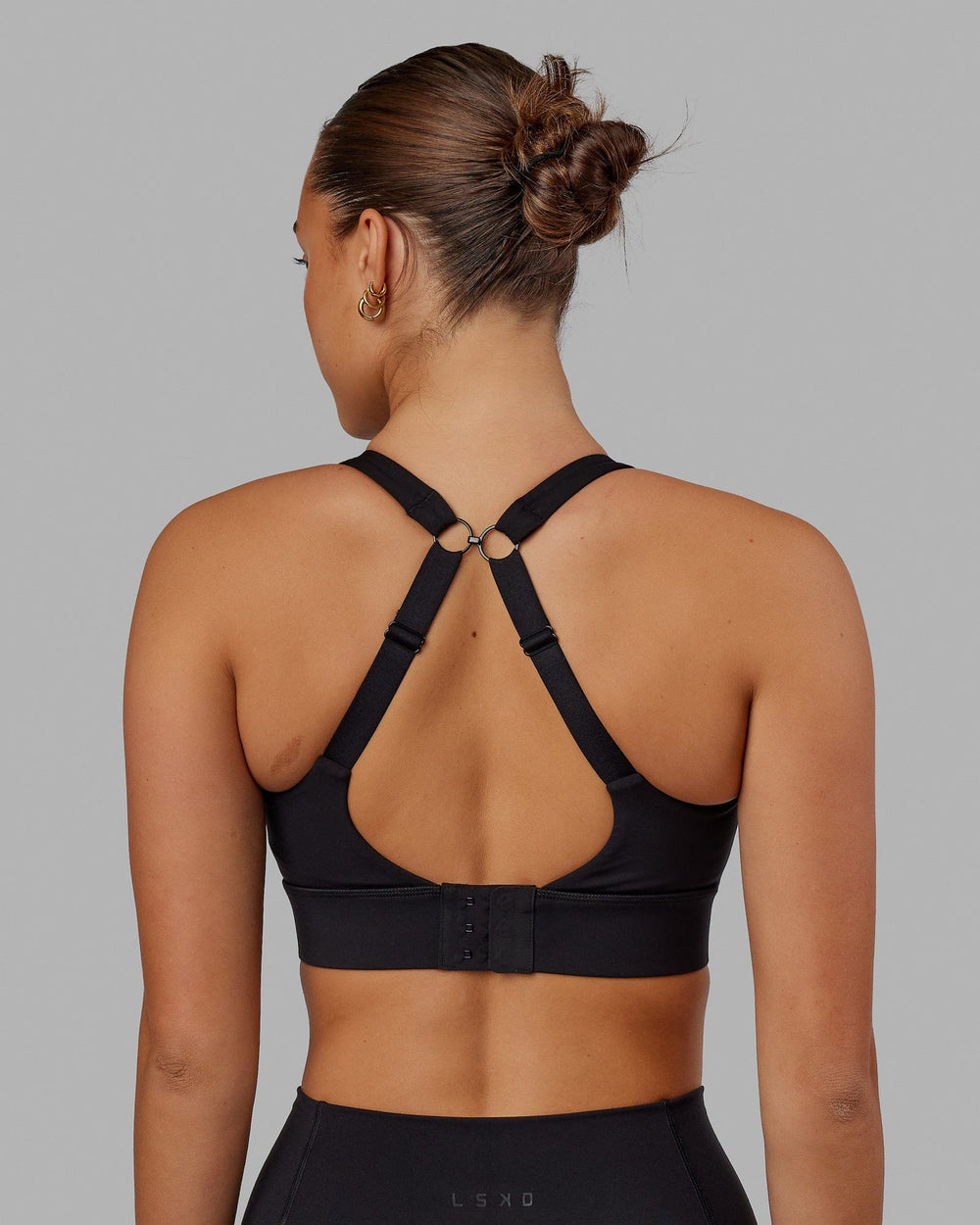 Woman wearing Propel Sports Bra - Black
