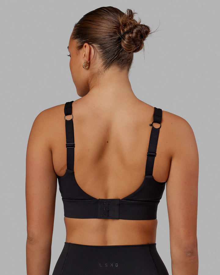 Woman wearing Propel Sports Bra - Black