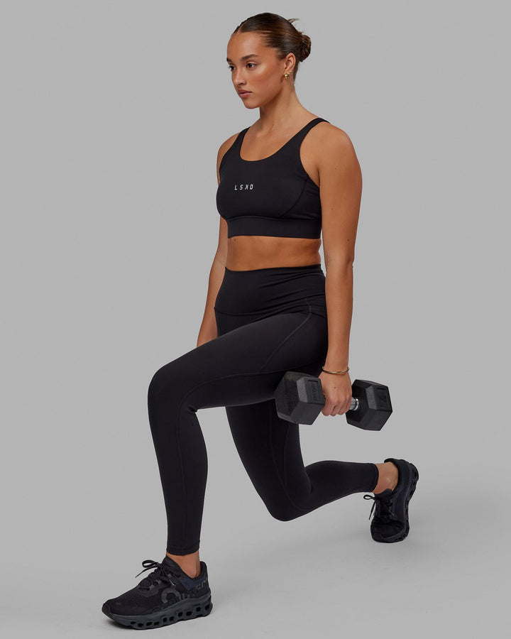 Woman wearing Propel Sports Bra - Black