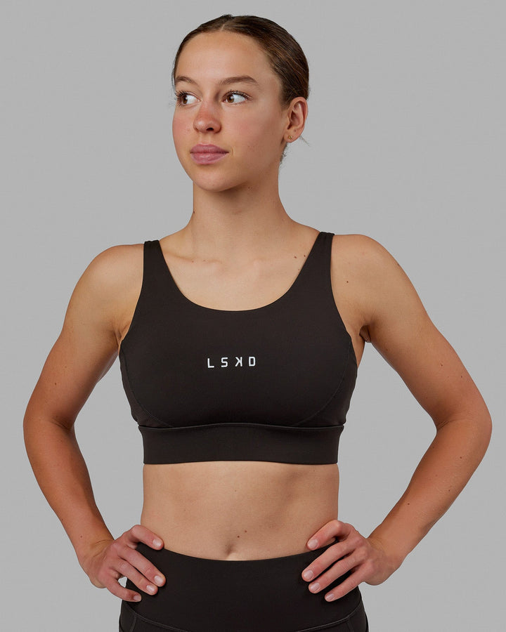 Woman wearing Propel Sports Bra - Dark Walnut