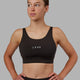 Woman wearing Propel Sports Bra - Dark Walnut