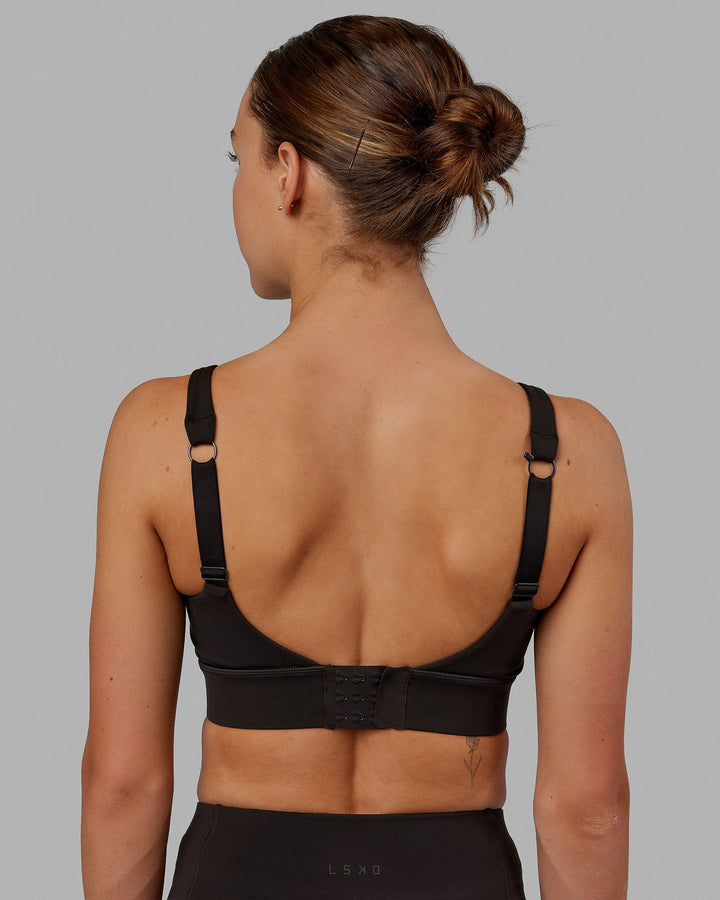 Woman wearing Propel Sports Bra - Dark Walnut