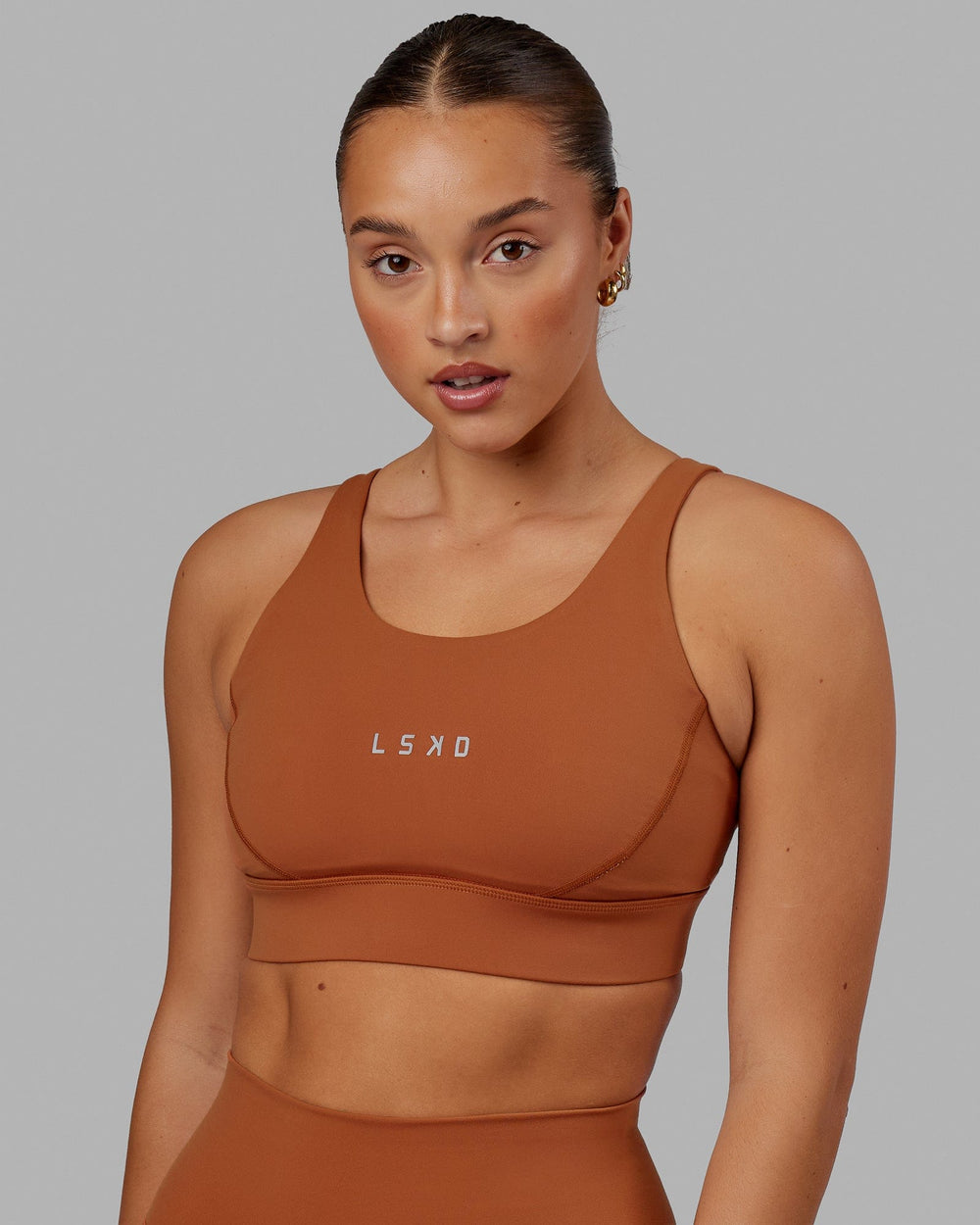 Woman wearing Propel Sports Bra - Hazel