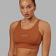 Woman wearing Propel Sports Bra - Hazel