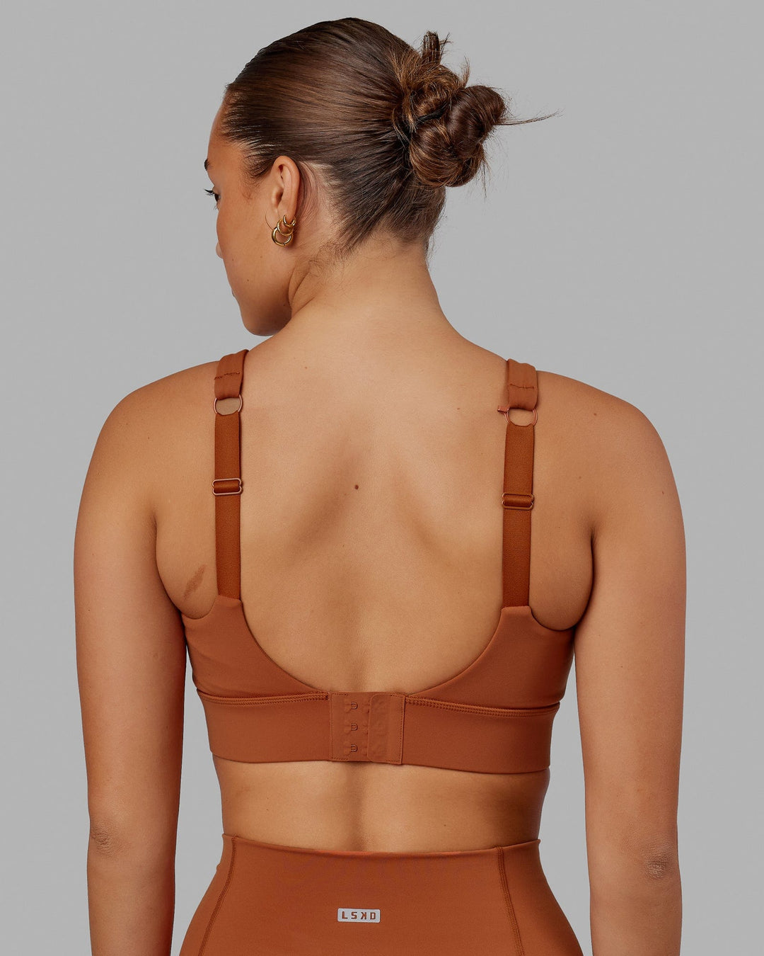 Woman wearing Propel Sports Bra - Hazel
