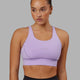 Woman wearing Propel Sports Bra - Pale Lilac