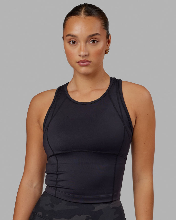 Woman wearing Propel Performance Tank - Black