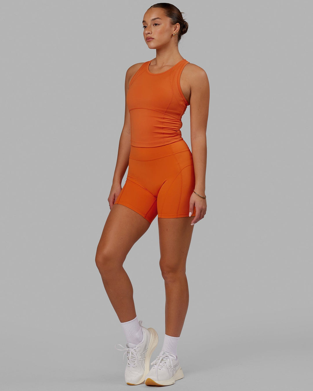 Woman wearing Propel Performance Tank - Burnt Orange