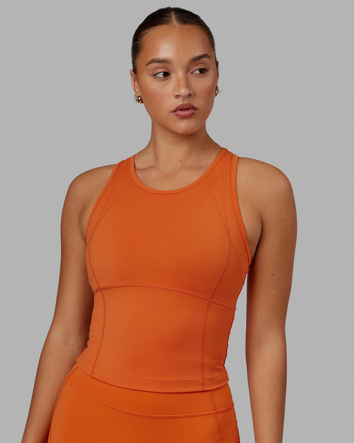 Woman wearing Propel Performance Tank - Burnt Orange