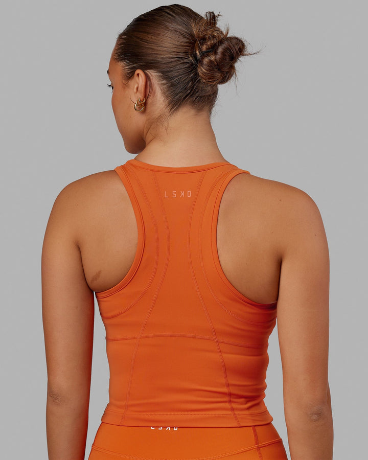 Woman wearing Propel Performance Tank - Burnt Orange