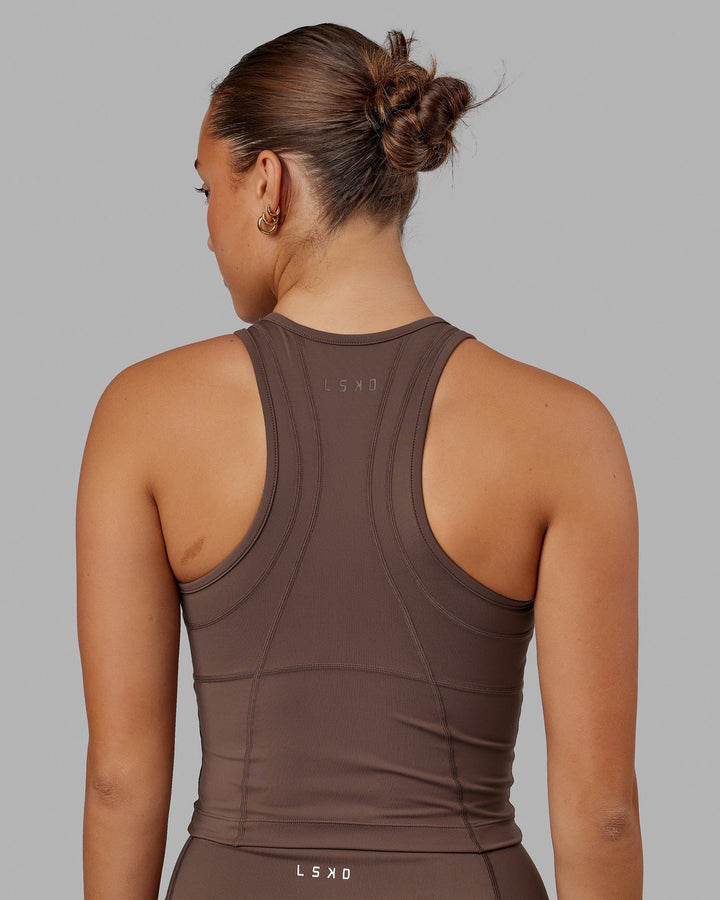 Woman wearing Propel Performance Tank - Peppercorn