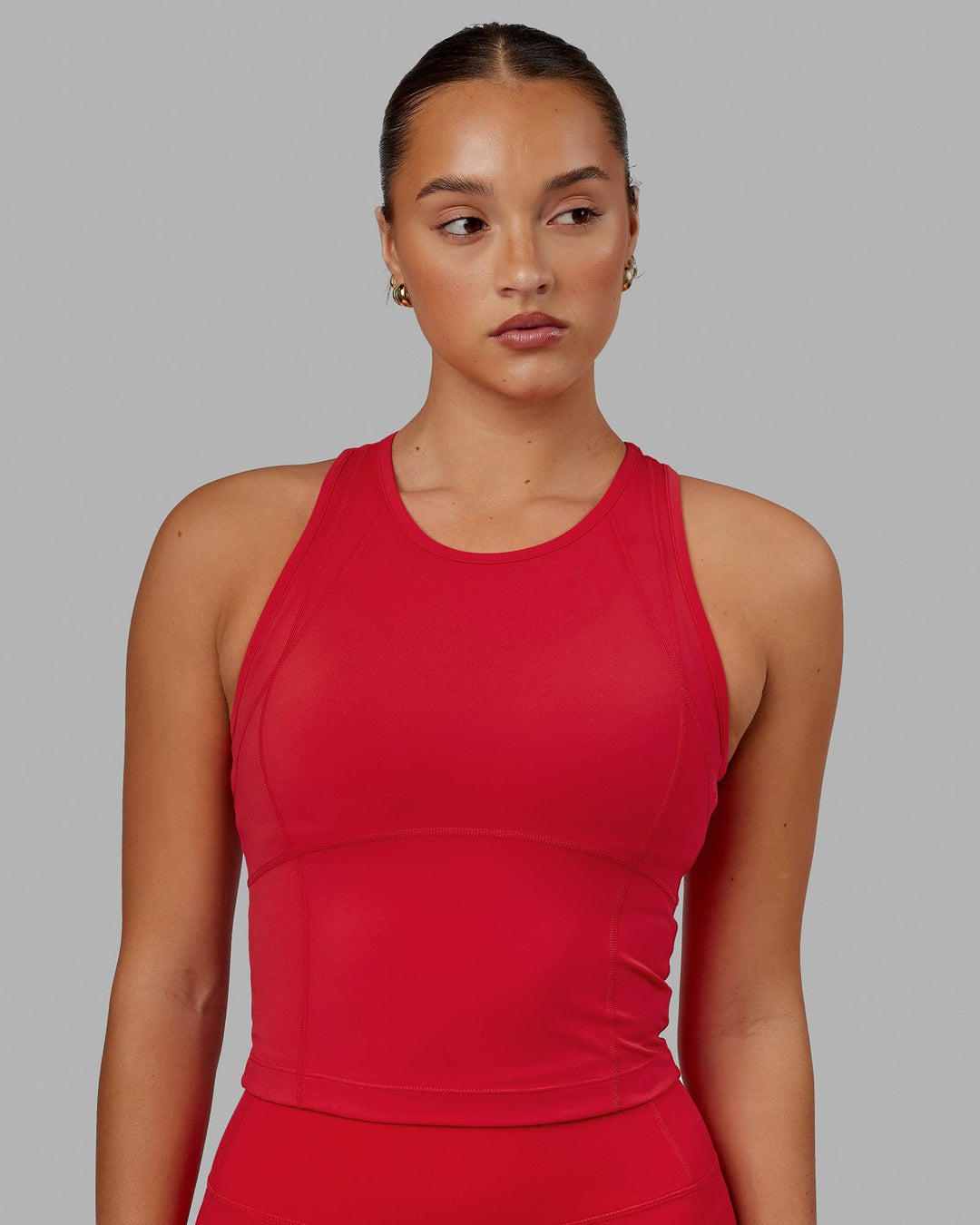 Woman wearing Propel Performance Tank - Scarlet