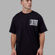Man wearing Proximity Long Line Tee Oversize - Black