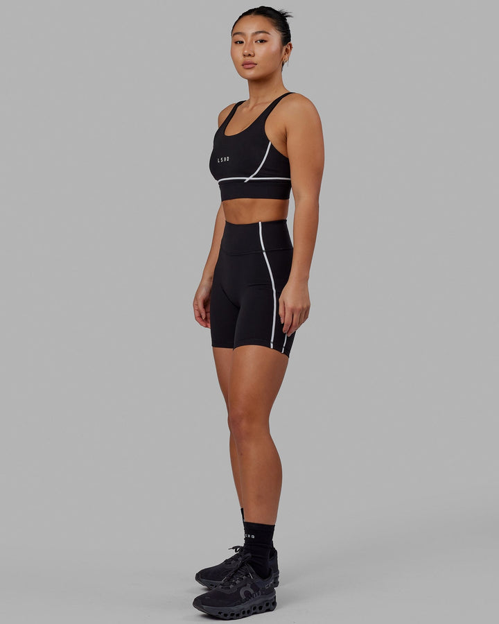 Woman wearing Pulse Mid Short Tight - Black