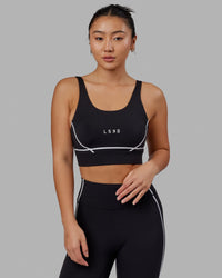 Woman wearing Pulse Sports Bra - Black